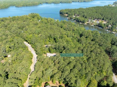 This beautiful, wooded lot on Snug Harbor in The Landing is the on Reynolds Lake Oconee - The Landing in Georgia - for sale on GolfHomes.com, golf home, golf lot