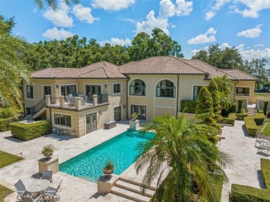Nestled within the gates of the renowned Isleworth Golf  Country on Isleworth Golf and Country Club in Florida - for sale on GolfHomes.com, golf home, golf lot
