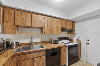 Turn-key and move-in ready! Welcome to this bright 2-bedroom, 1 on Cove Cay Country Club in Florida - for sale on GolfHomes.com, golf home, golf lot