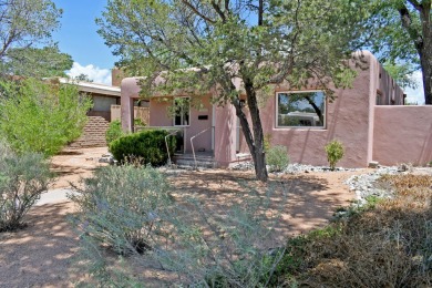 Charming North Campus location! This pueblo style  home has on North Course - University of New Mexico  in New Mexico - for sale on GolfHomes.com, golf home, golf lot