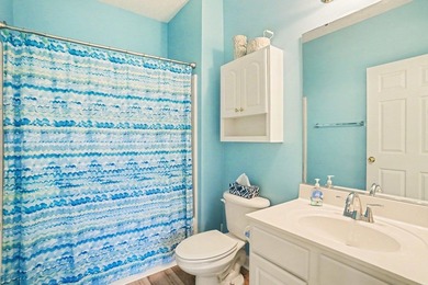 Welcome to this bright and beachy 2-bedroom, 2-bath end-unit on  in South Carolina - for sale on GolfHomes.com, golf home, golf lot