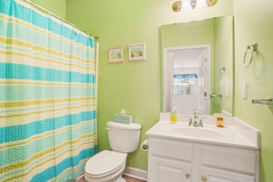 Welcome to this bright and beachy 2-bedroom, 2-bath end-unit on  in South Carolina - for sale on GolfHomes.com, golf home, golf lot