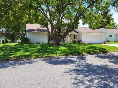 Welcome to this incredibly spacious three-bedroom, two-bathroom on Beacon Woods Golf Club in Florida - for sale on GolfHomes.com, golf home, golf lot