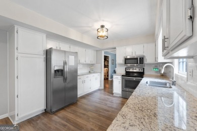 Updated 4-bedroom, 2 and a half bathroom home situated on on Braelinn Golf Club in Georgia - for sale on GolfHomes.com, golf home, golf lot