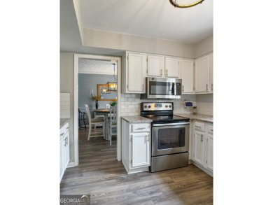 Updated 4-bedroom, 2 and a half bathroom home situated on on Braelinn Golf Club in Georgia - for sale on GolfHomes.com, golf home, golf lot
