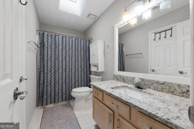 Updated 4-bedroom, 2 and a half bathroom home situated on on Braelinn Golf Club in Georgia - for sale on GolfHomes.com, golf home, golf lot