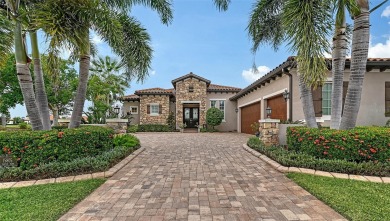 Positioned on a premier homesite with water on two sides and on Ritz-Carlton Members Golf Club in Florida - for sale on GolfHomes.com, golf home, golf lot
