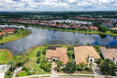 Positioned on a premier homesite with water on two sides and on Ritz-Carlton Members Golf Club in Florida - for sale on GolfHomes.com, golf home, golf lot
