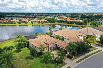 Positioned on a premier homesite with water on two sides and on Ritz-Carlton Members Golf Club in Florida - for sale on GolfHomes.com, golf home, golf lot