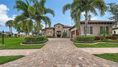 Positioned on a premier homesite with water on two sides and on Ritz-Carlton Members Golf Club in Florida - for sale on GolfHomes.com, golf home, golf lot