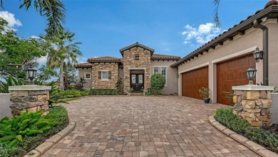 Positioned on a premier homesite with water on two sides and on Ritz-Carlton Members Golf Club in Florida - for sale on GolfHomes.com, golf home, golf lot