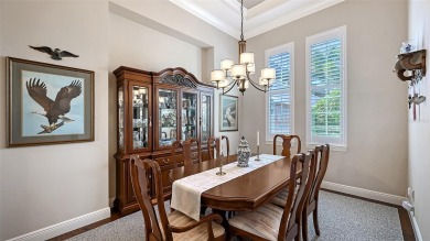 Positioned on a premier homesite with water on two sides and on Ritz-Carlton Members Golf Club in Florida - for sale on GolfHomes.com, golf home, golf lot
