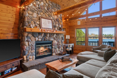 Lakefront Log Home – Private Beach & Docks on Lake Camelot on Sand Valley Golf Course in Wisconsin - for sale on GolfHomes.com, golf home, golf lot