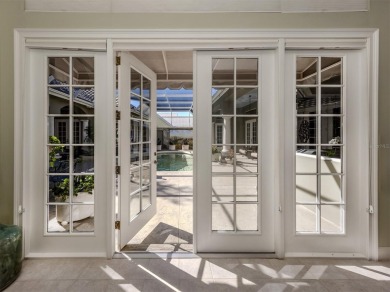 Timeless and traditional custom built Arthur Rutenberg courtyard on Plantation Golf and Country Club in Florida - for sale on GolfHomes.com, golf home, golf lot