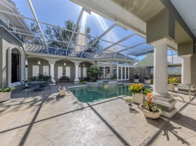 Timeless and traditional custom built Arthur Rutenberg courtyard on Plantation Golf and Country Club in Florida - for sale on GolfHomes.com, golf home, golf lot