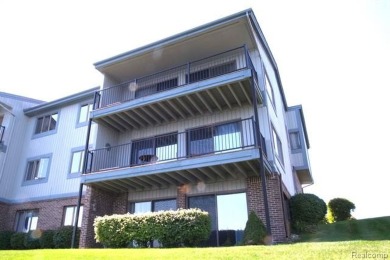 This stunning and spacious end unit condominium with premium on St Clair River Country Club in Michigan - for sale on GolfHomes.com, golf home, golf lot