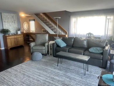 This stunning and spacious end unit condominium with premium on St Clair River Country Club in Michigan - for sale on GolfHomes.com, golf home, golf lot