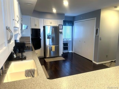 This stunning and spacious end unit condominium with premium on St Clair River Country Club in Michigan - for sale on GolfHomes.com, golf home, golf lot