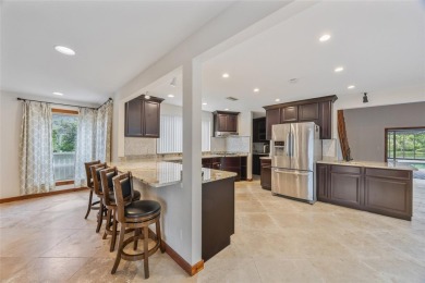 Welcome to waterfront living at its finest. This home is located on Seminole Lake Country Club in Florida - for sale on GolfHomes.com, golf home, golf lot