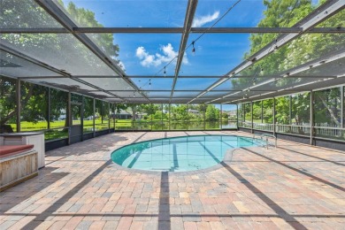 Welcome to waterfront living at its finest. This home is located on Seminole Lake Country Club in Florida - for sale on GolfHomes.com, golf home, golf lot