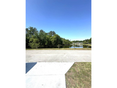 Escape to serenity in this charming 2-bedroom home, boasting on Schalamar Creek Golf and Country Club in Florida - for sale on GolfHomes.com, golf home, golf lot