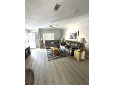 Escape to serenity in this charming 2-bedroom home, boasting on Schalamar Creek Golf and Country Club in Florida - for sale on GolfHomes.com, golf home, golf lot