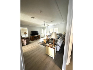 Escape to serenity in this charming 2-bedroom home, boasting on Schalamar Creek Golf and Country Club in Florida - for sale on GolfHomes.com, golf home, golf lot