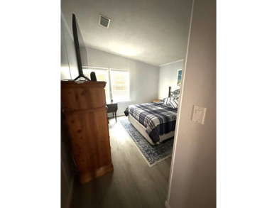 Escape to serenity in this charming 2-bedroom home, boasting on Schalamar Creek Golf and Country Club in Florida - for sale on GolfHomes.com, golf home, golf lot