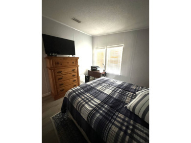 Escape to serenity in this charming 2-bedroom home, boasting on Schalamar Creek Golf and Country Club in Florida - for sale on GolfHomes.com, golf home, golf lot