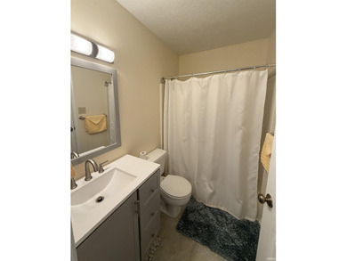 This inviting Lake Monroe condo features soaring ceilings and on The Eagle Pointe Golf Resort in Indiana - for sale on GolfHomes.com, golf home, golf lot