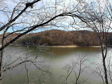 This inviting Lake Monroe condo features soaring ceilings and on The Eagle Pointe Golf Resort in Indiana - for sale on GolfHomes.com, golf home, golf lot