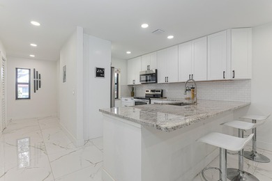 Stunning second-story condo in the prestigious Boca Lago Golf & on Boca Lago Golf and Country Club in Florida - for sale on GolfHomes.com, golf home, golf lot