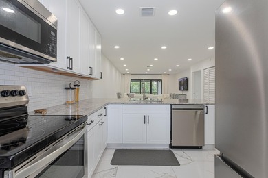 Stunning second-story condo in the prestigious Boca Lago Golf & on Boca Lago Golf and Country Club in Florida - for sale on GolfHomes.com, golf home, golf lot