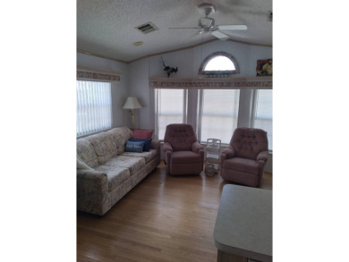 Furnished Park Model on large corner lot with shed and spacious on Deer Creek RV Golf Resort in Florida - for sale on GolfHomes.com, golf home, golf lot