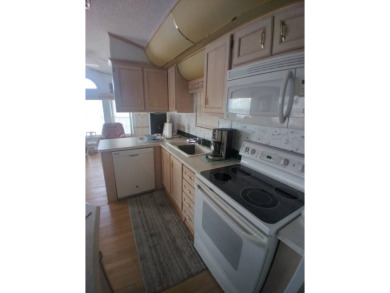 Furnished Park Model on large corner lot with shed and spacious on Deer Creek RV Golf Resort in Florida - for sale on GolfHomes.com, golf home, golf lot