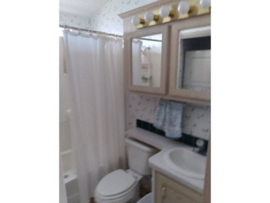 Furnished Park Model on large corner lot with shed and spacious on Deer Creek RV Golf Resort in Florida - for sale on GolfHomes.com, golf home, golf lot