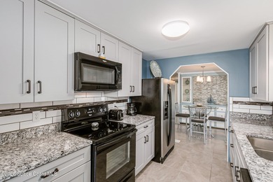 Immaculate and exquisitely updated 2-bedroom, 2-bathroom retreat on Barefoot Bay Golf Course in Florida - for sale on GolfHomes.com, golf home, golf lot