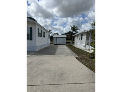 Furnished Park Model on large corner lot with shed and spacious on Deer Creek RV Golf Resort in Florida - for sale on GolfHomes.com, golf home, golf lot