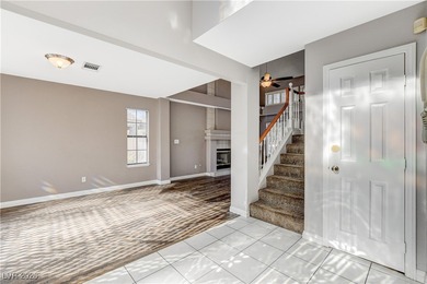 This 2-story home is located in Painted Desert, a guard-gated on Painted Desert Golf Club in Nevada - for sale on GolfHomes.com, golf home, golf lot