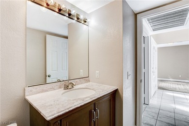 This 2-story home is located in Painted Desert, a guard-gated on Painted Desert Golf Club in Nevada - for sale on GolfHomes.com, golf home, golf lot