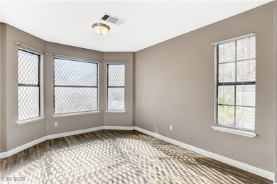 This 2-story home is located in Painted Desert, a guard-gated on Painted Desert Golf Club in Nevada - for sale on GolfHomes.com, golf home, golf lot