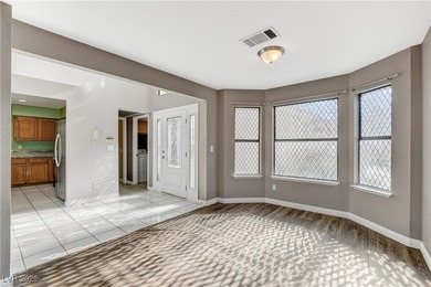 This 2-story home is located in Painted Desert, a guard-gated on Painted Desert Golf Club in Nevada - for sale on GolfHomes.com, golf home, golf lot