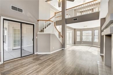 This 2-story home is located in Painted Desert, a guard-gated on Painted Desert Golf Club in Nevada - for sale on GolfHomes.com, golf home, golf lot