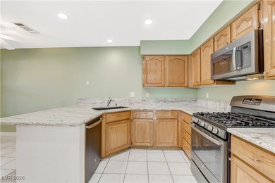 This 2-story home is located in Painted Desert, a guard-gated on Painted Desert Golf Club in Nevada - for sale on GolfHomes.com, golf home, golf lot