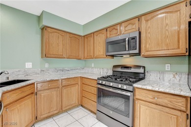 This 2-story home is located in Painted Desert, a guard-gated on Painted Desert Golf Club in Nevada - for sale on GolfHomes.com, golf home, golf lot