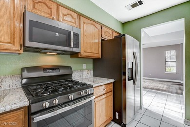 This 2-story home is located in Painted Desert, a guard-gated on Painted Desert Golf Club in Nevada - for sale on GolfHomes.com, golf home, golf lot