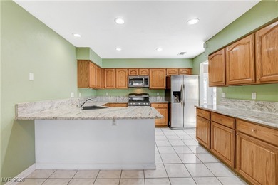 This 2-story home is located in Painted Desert, a guard-gated on Painted Desert Golf Club in Nevada - for sale on GolfHomes.com, golf home, golf lot