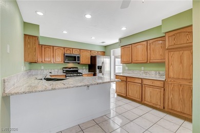 This 2-story home is located in Painted Desert, a guard-gated on Painted Desert Golf Club in Nevada - for sale on GolfHomes.com, golf home, golf lot