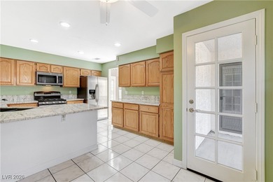 This 2-story home is located in Painted Desert, a guard-gated on Painted Desert Golf Club in Nevada - for sale on GolfHomes.com, golf home, golf lot