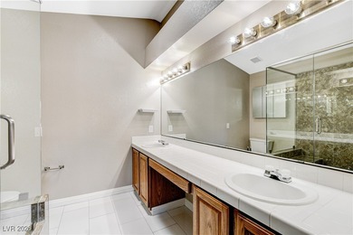 This 2-story home is located in Painted Desert, a guard-gated on Painted Desert Golf Club in Nevada - for sale on GolfHomes.com, golf home, golf lot